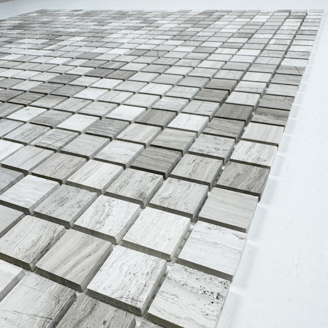 Close-up of gray mosaic tiles on a white background