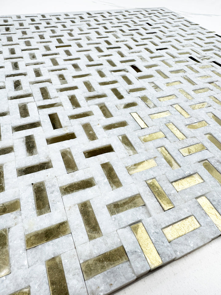 White marble mosaic with gold stainless steel split surface